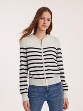 a lady in a pure cashmere hooded zipper cardigan with jeans